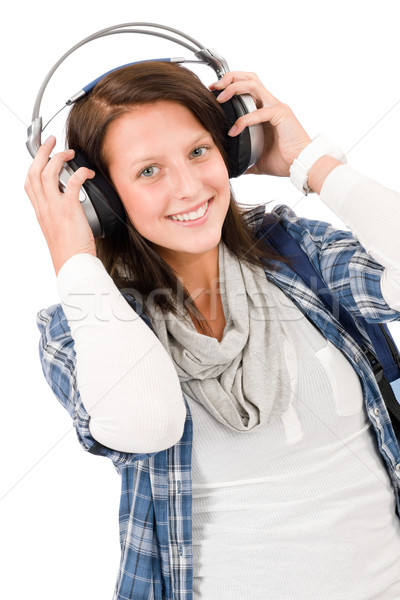 Smiling female teenager enjoy music headphones Stock photo © CandyboxPhoto