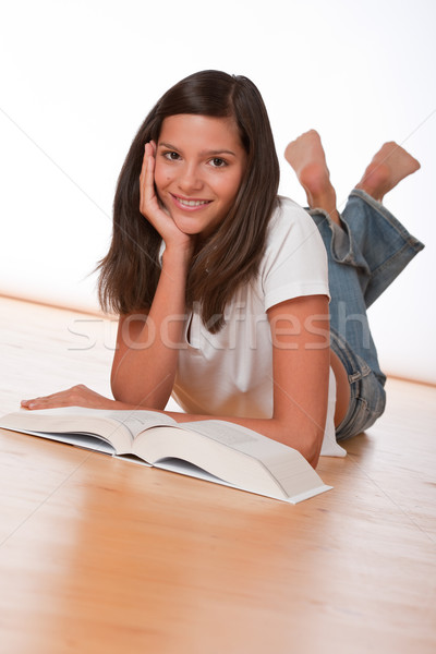 Happy teenager lying down with book  Stock photo © CandyboxPhoto