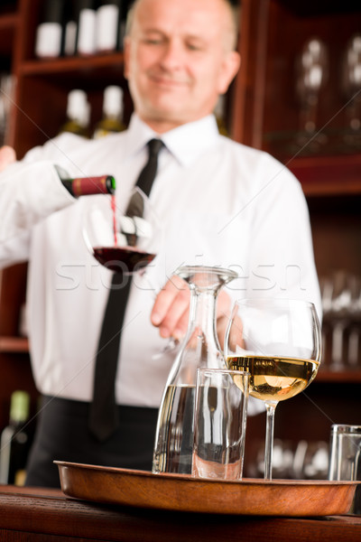 Wine bar waiter pour glass in restaurant Stock photo © CandyboxPhoto
