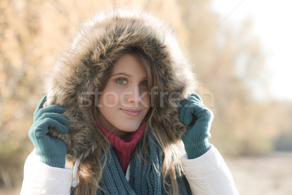 Stock photo: Winter fashion - woman with fur hood outside