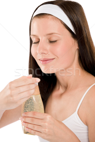 Stock photo: Body care - woman smelling shampoo