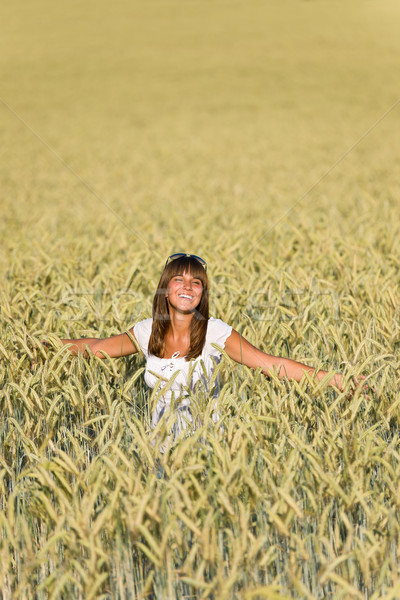 Happy young woman in corn field enjoy sunset Stock photo © CandyboxPhoto
