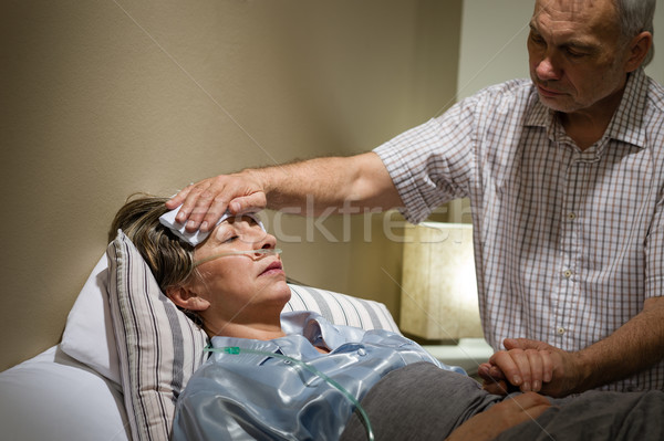 Caring senior man helping his sick wife Stock photo © CandyboxPhoto