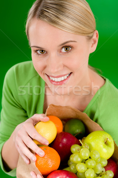 Healthy lifestyle - woman with fruit shopping paper bag  Stock photo © CandyboxPhoto