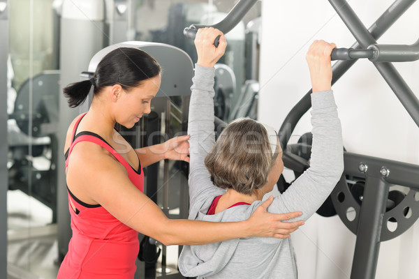 Stock photo: Fitness center trainer senior woman exercise shoulder