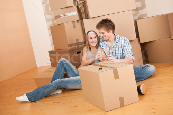 Moving house: Happy man and woman celebrating Stock photo © CandyboxPhoto
