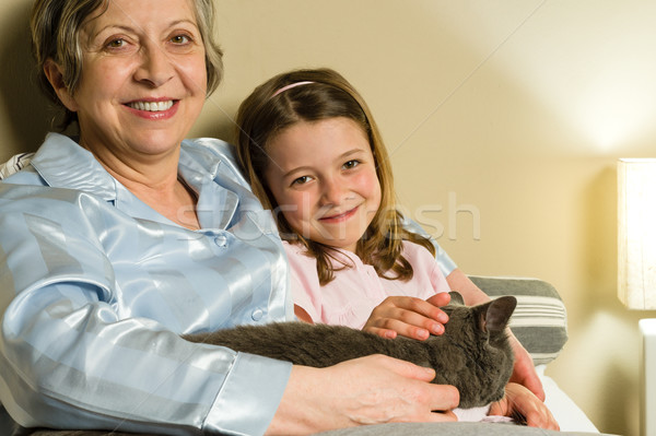 Cheerful senior woman with granddaughter and cat Stock photo © CandyboxPhoto