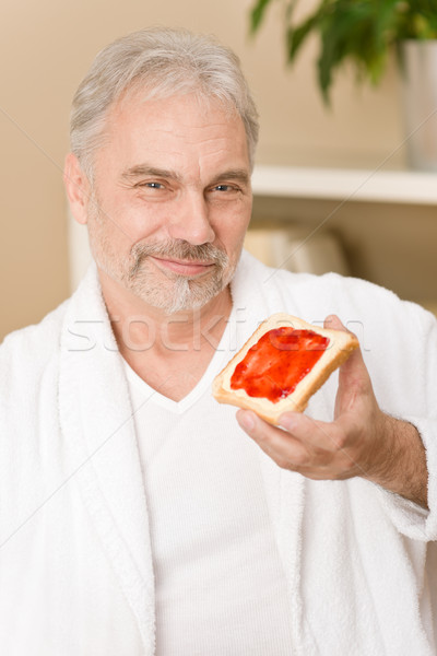 Idős érett férfi reggeli otthon eszik kenyér Stock fotó © CandyboxPhoto