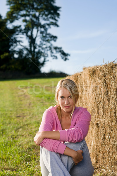 Sportive young woman relax by bales sunset Stock photo © CandyboxPhoto