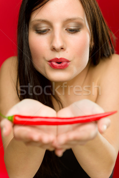 Chili pepper - portrait young woman blow on red hot Stock photo © CandyboxPhoto