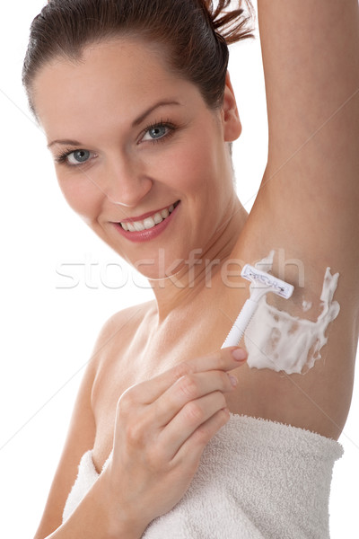 Body care series - Smiling woman shaving her armpit Stock photo © CandyboxPhoto