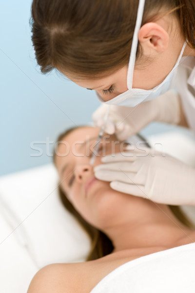 Botox injection - woman in cosmetic medicine treatment Stock photo © CandyboxPhoto