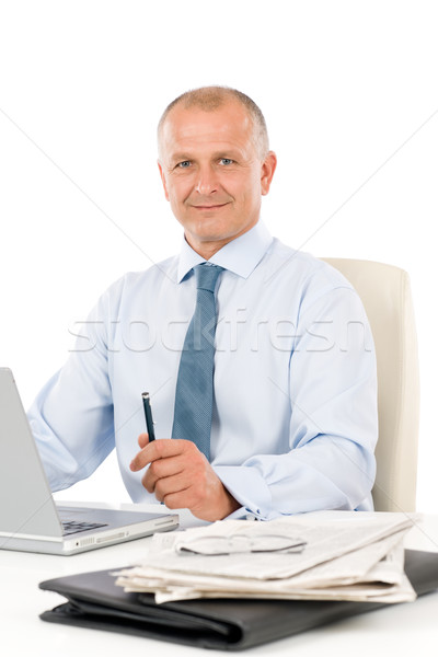Stock photo: Happy businessman working in office behind desk