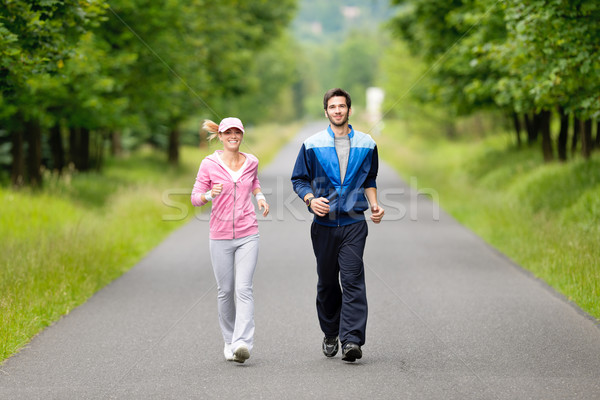 Stock photo: Jogging sportive young couple running park road