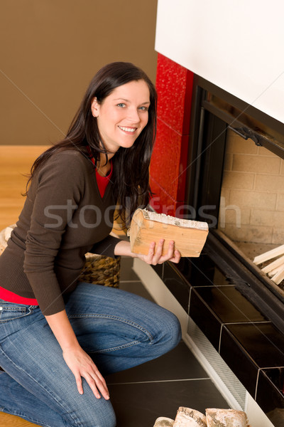 Home fireplace woman put logs happy winter Stock photo © CandyboxPhoto