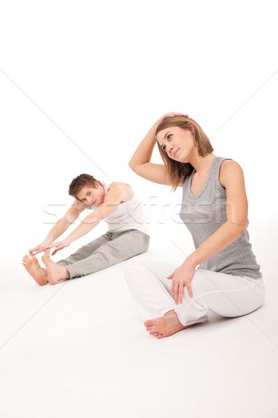 Fitness - Healthy couple stretching after training on white Stock photo © CandyboxPhoto