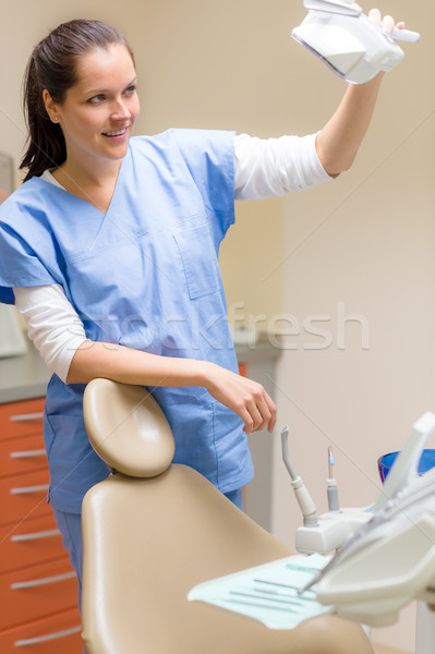 Female dentist prepare patient chair at surgery Stock photo © CandyboxPhoto
