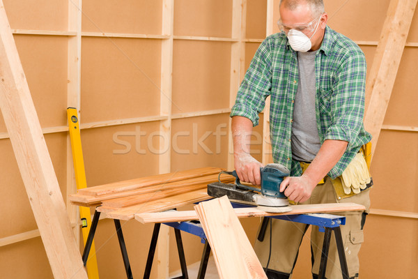 Handyman sanding wooden board diy home renovation Stock photo © CandyboxPhoto