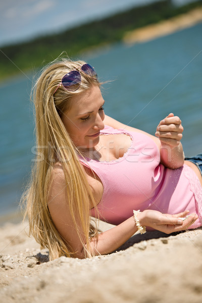 Hermosa rubio mujer jugando arena soleado Foto stock © CandyboxPhoto