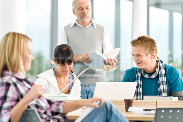 High school - three students with mature professor Stock photo © CandyboxPhoto