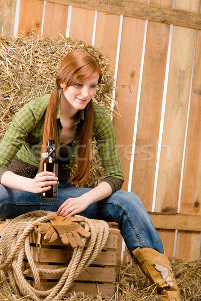 Provocative young cowgirl drink beer in barn Stock photo © CandyboxPhoto