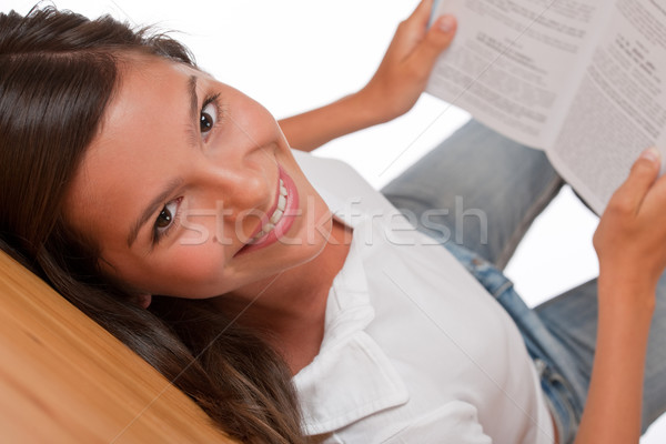 Stock photo: Brown hair teenager lying down on wooden floor 