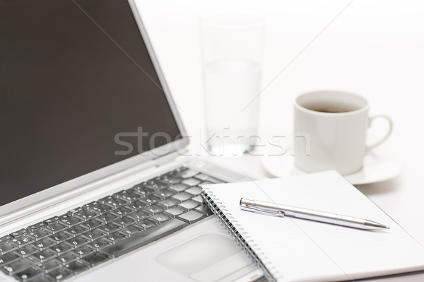 Office desk laptop with notepad and pen Stock photo © CandyboxPhoto
