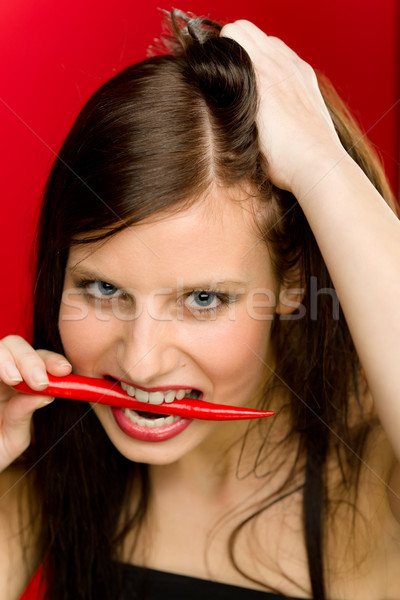 Retrato mulher jovem morder vermelho picante Foto stock © CandyboxPhoto