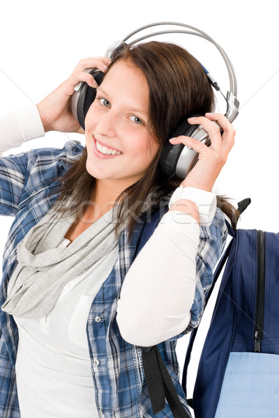 Smiling female teenager enjoy music headphones Stock photo © CandyboxPhoto