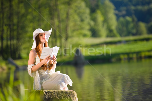 Long red hair romantic woman relax by lake with book  Stock photo © CandyboxPhoto