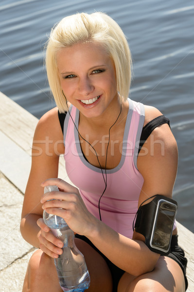 Stock photo: Sport woman smiling relax water sitting pier