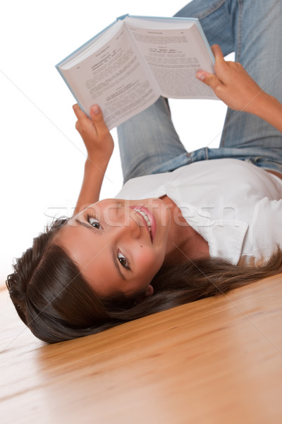 Brown hair teenager lying down on wooden floor  Stock photo © CandyboxPhoto