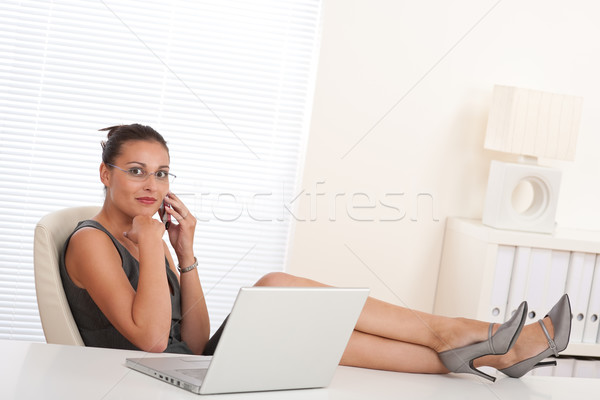 Female manager working with legs up Stock photo © CandyboxPhoto