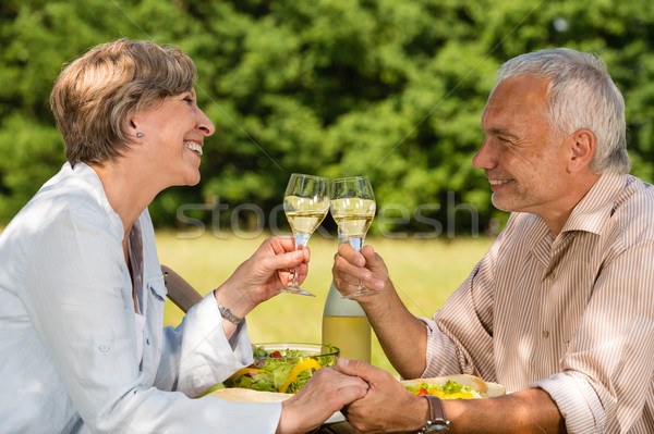 Elderly couple celebrating outdoors Stock photo © CandyboxPhoto