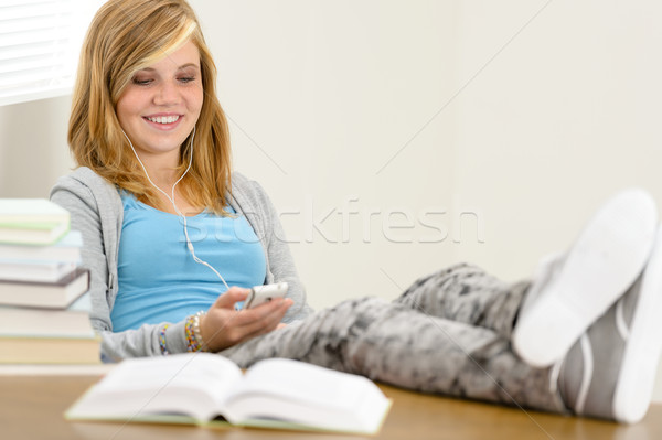 Smiling student teenager relaxing legs on table Stock photo © CandyboxPhoto