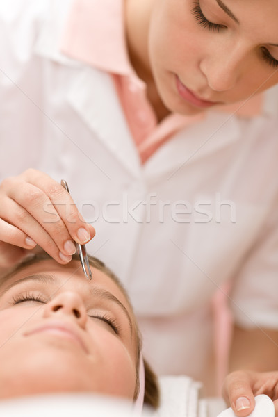 Woman remove eyebrows by tweezers Stock photo © CandyboxPhoto