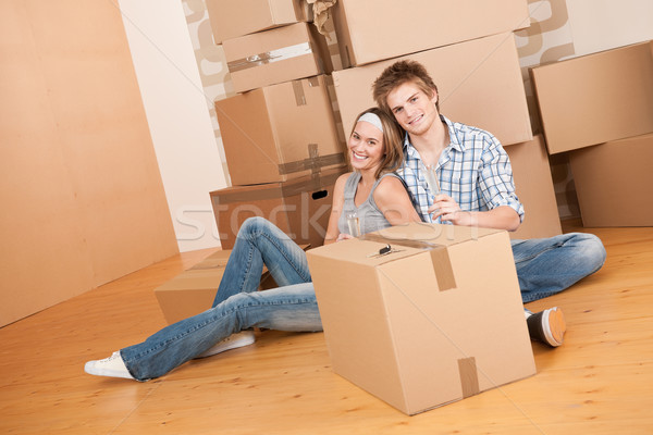 Moving house: Happy man and woman celebrating Stock photo © CandyboxPhoto