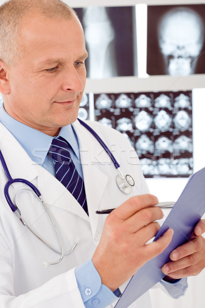 Mature doctor male look aside at x-ray Stock photo © CandyboxPhoto