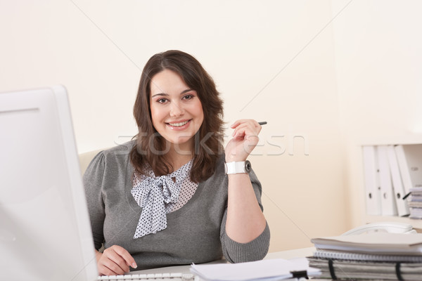 Stock photo: Young business woman working with computer at office