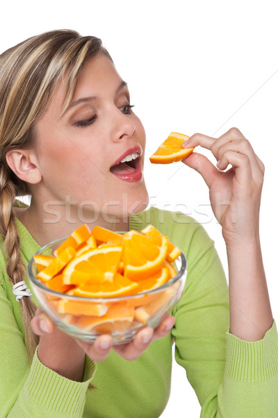 Zdjęcia stock: Kobieta · jedzenie · pomarańczowy · biały · kobiet