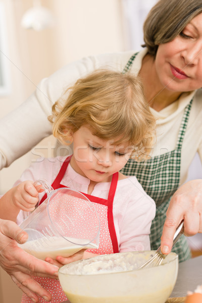 Grandmother and granddaughter baking cookies Stock photo © CandyboxPhoto