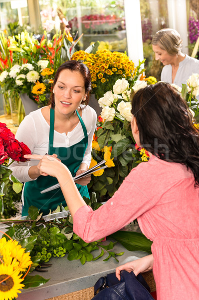 Young florist ordering roses woman customer flower  Stock photo © CandyboxPhoto