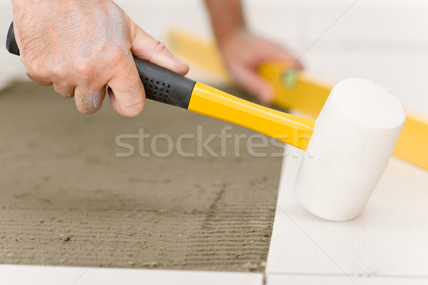 Home improvement, renovation - handyman laying tile Stock photo © CandyboxPhoto