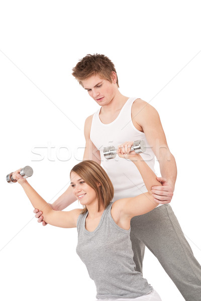 Fitness - Young woman with instructor lifting weights  Stock photo © CandyboxPhoto