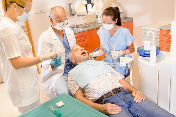 Senior man at dentist surgery have treatment Stock photo © CandyboxPhoto