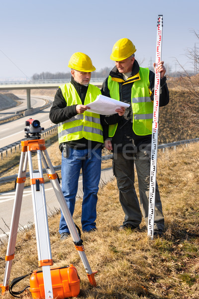 Geodesist read plans on construction site Stock photo © CandyboxPhoto