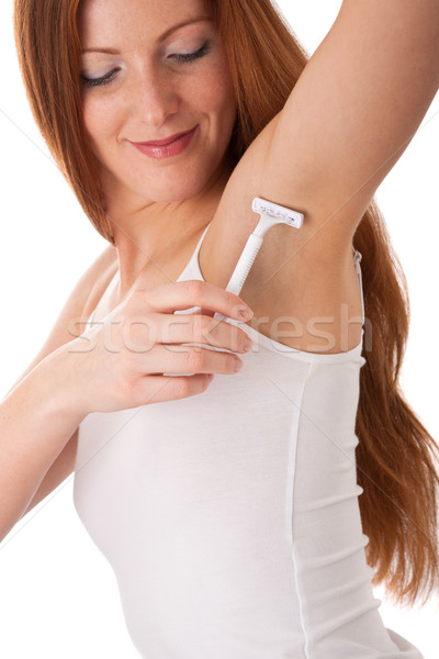 Body care series - Smiling red hair woman shaving her armpit Stock photo © CandyboxPhoto