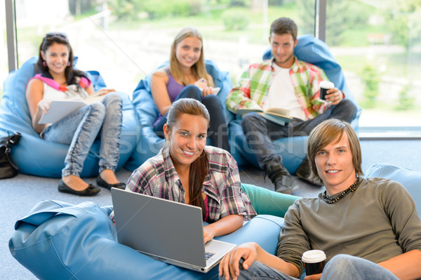 Students sitting on beanbags in study room in study room Stock photo © CandyboxPhoto