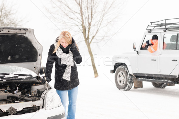 Woman looking under broken car hood snow Stock photo © CandyboxPhoto