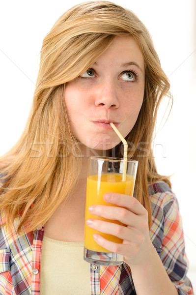 Dreamy blonde girl sipping orange juice Stock photo © CandyboxPhoto